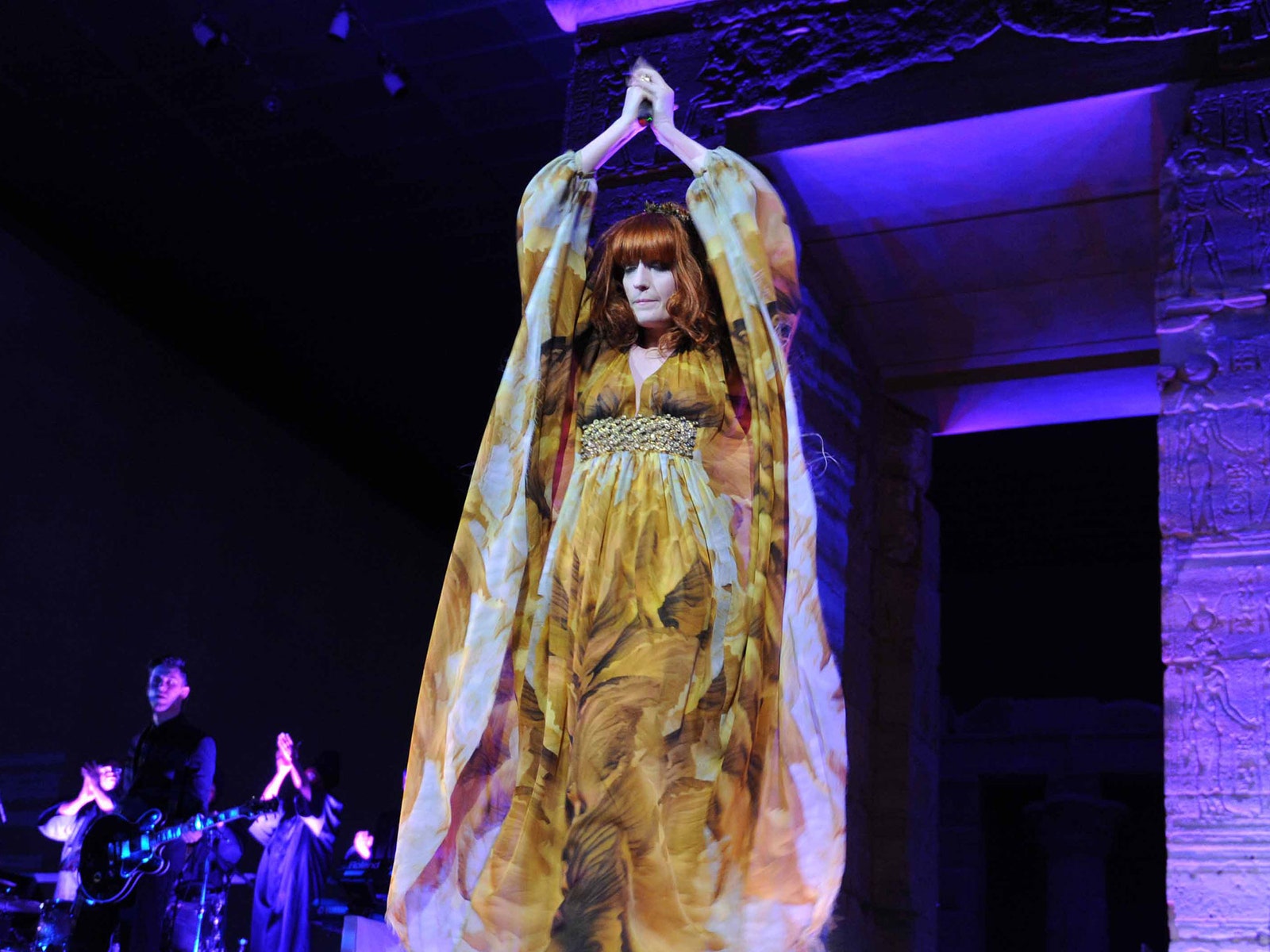 Image may contain Stage Dance Pose Leisure Activities Florence Welch Human Person Crowd and Musical Instrument